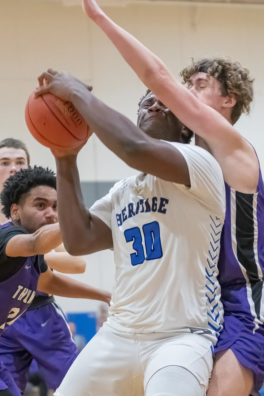 High school basketball player battles through contact in the post during a Minnesota game day